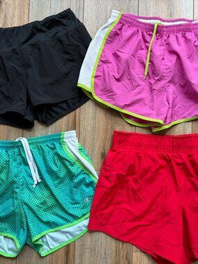 Bundle of 4 ladies running shorts Reebok Champion Athletic Works size medium pin
